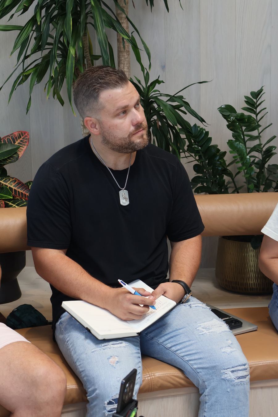 Jeremy Davis taking notes in a notebook